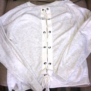Barely worn soft pullover with lace up back!